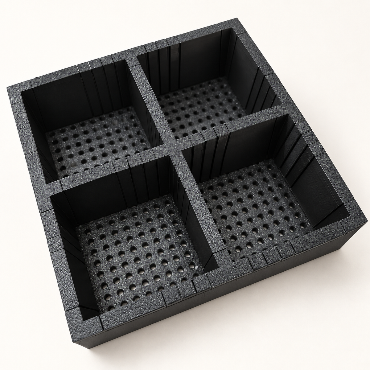 Design 2 make-up organiser with four square compartments, angled view