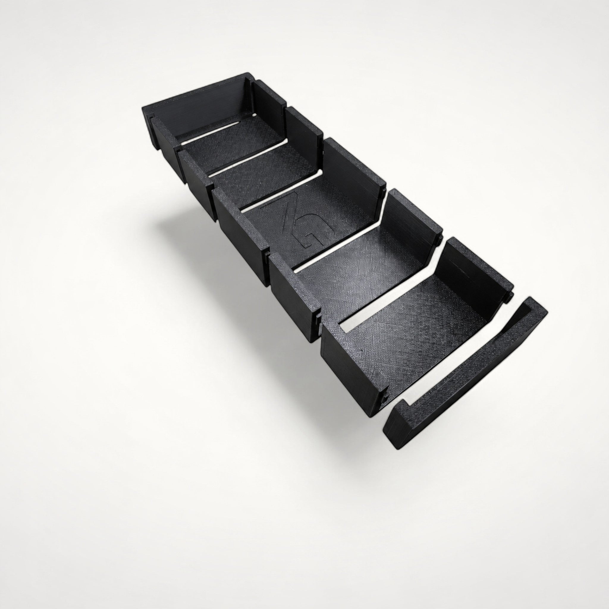 NG Organisers black 3D-printed modular drawer storage box with a textured finish and central branded module.