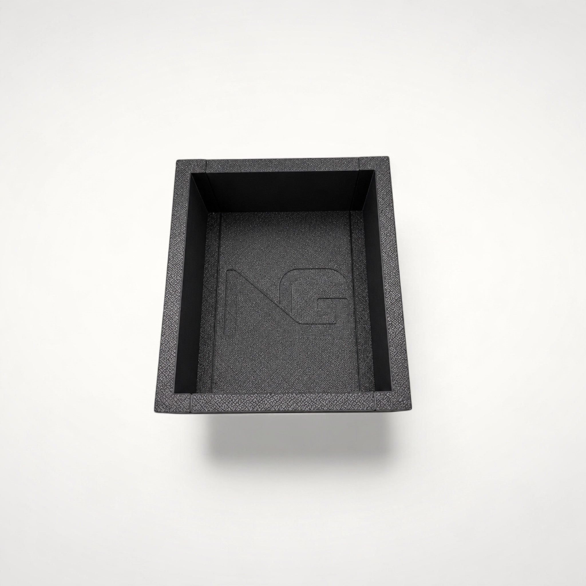 NG Organisers black modular storage box with textured finish and embossed logo for drawer organisation.