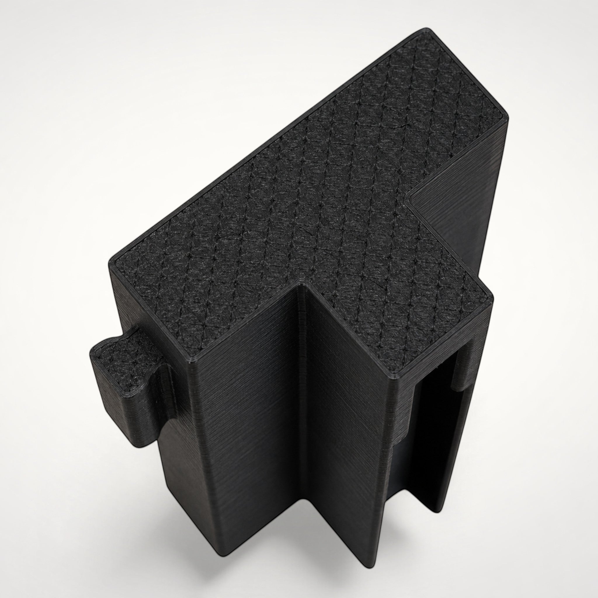 NG Organisers black T-shaped double female wall module for drawer divider systems with a textured top surface.