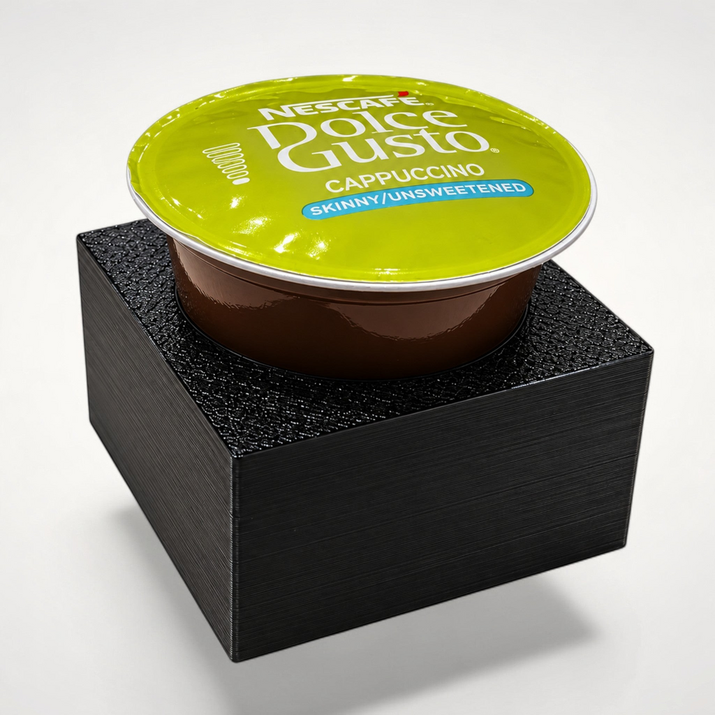 NG Organisers black modular drawer insert holding a single Dolce Gusto coffee pod on a white background