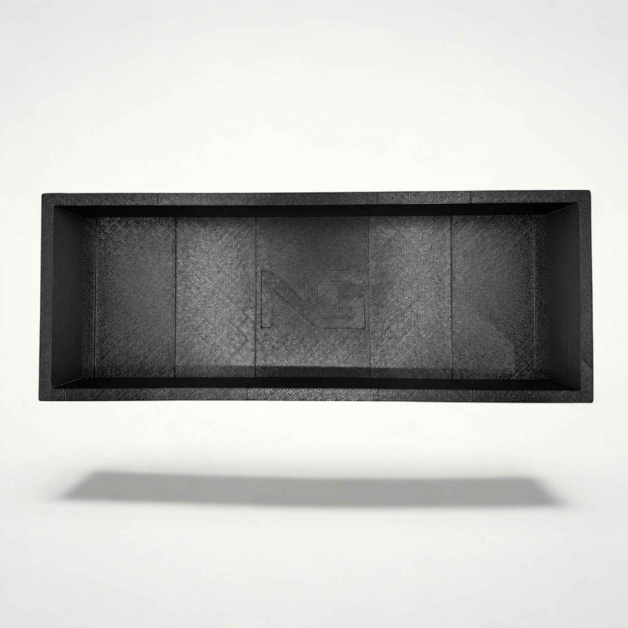 NG Organisers modular black 3D-printed drawer storage box with a textured finish and central logo detail.
