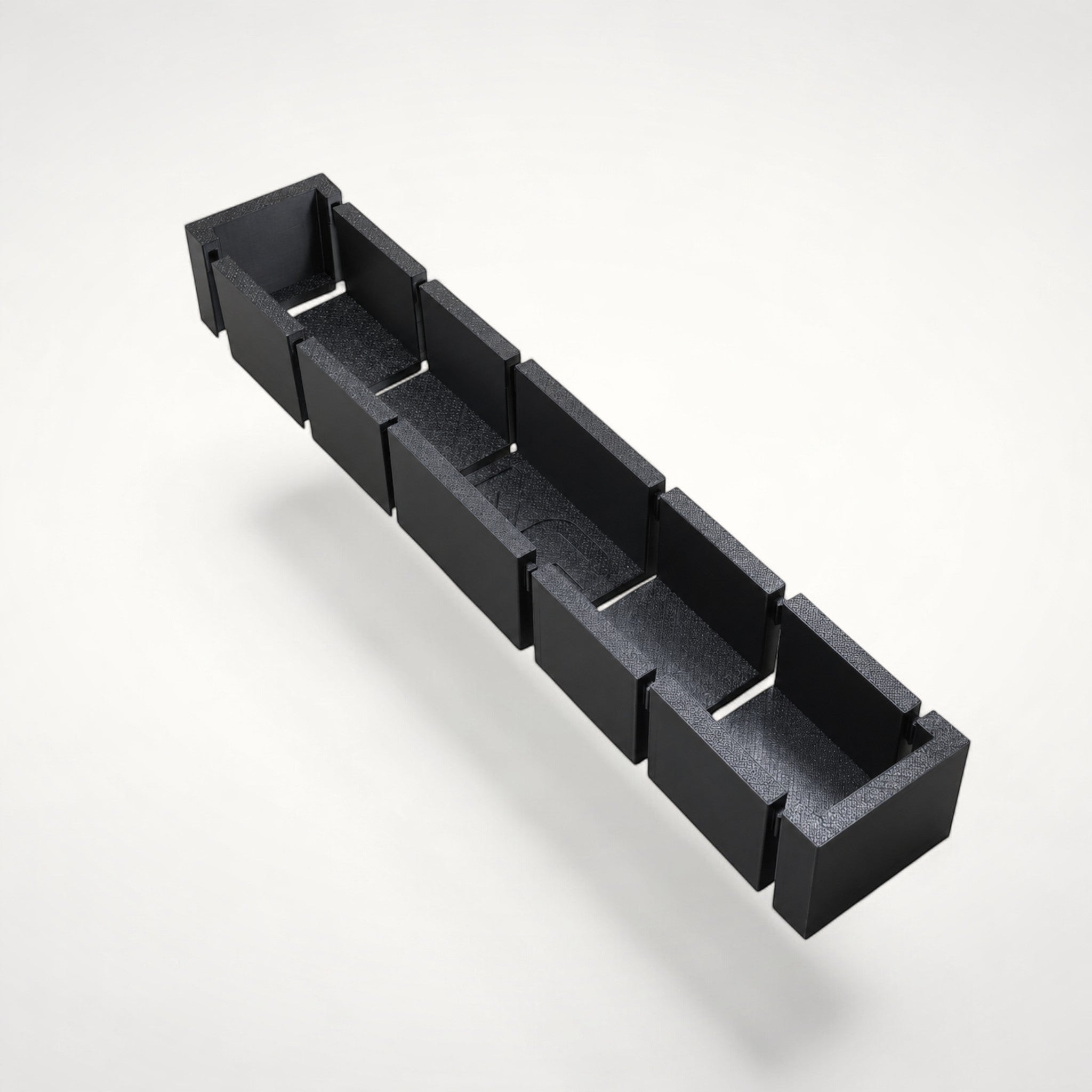 NG Organisers modular black storage box insert for drawers, 380x70mm size with seven-piece assembly.
