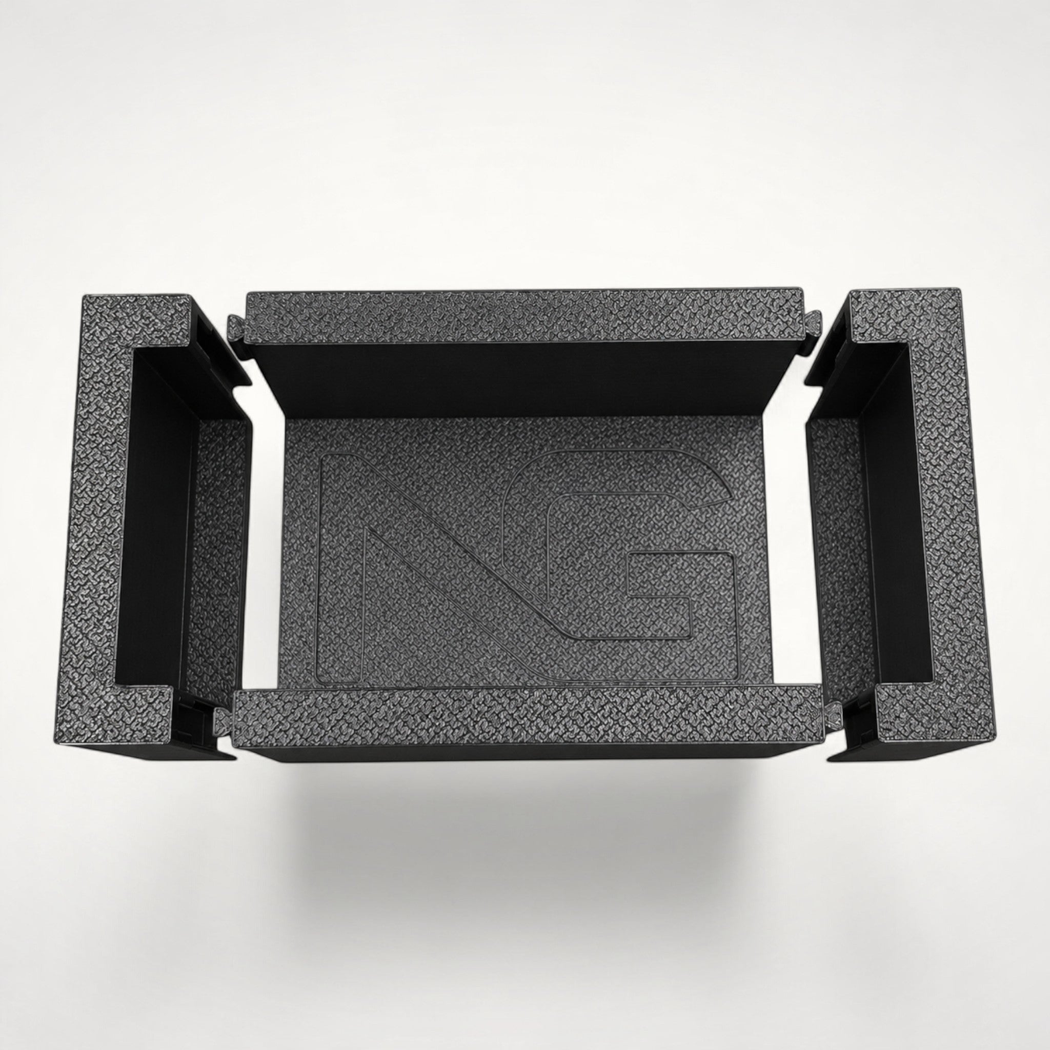 NG Organisers modular storage box insert with textured black finish and branded centre piece for drawer organisation.