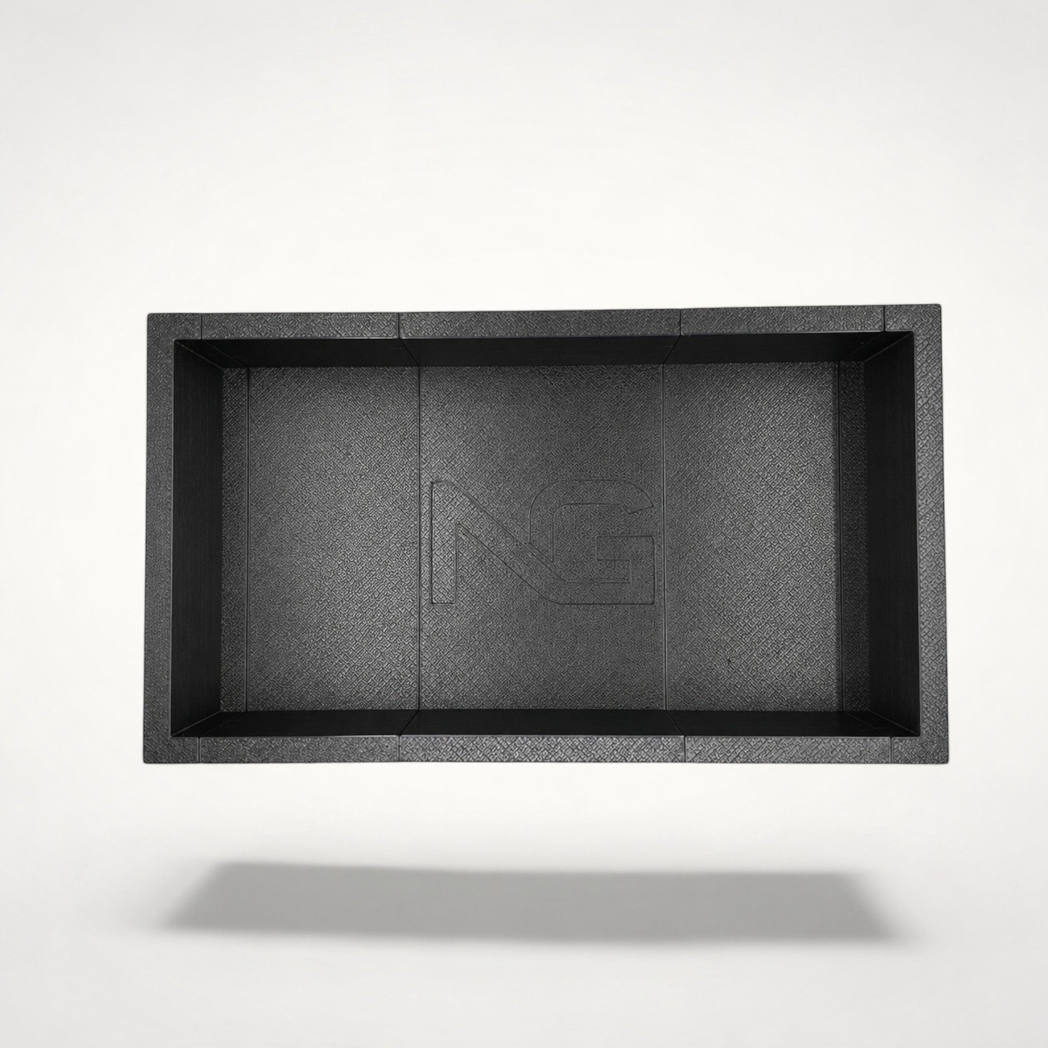 NG Organisers modular storage box in black with a textured finish and branded centre panel, top-down view.
