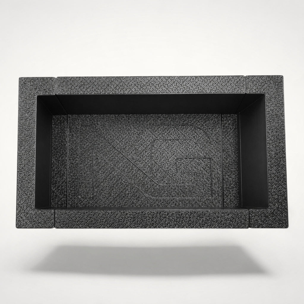 NG Organisers modular storage box in black with a textured finish and branded centre module for drawer organisation.