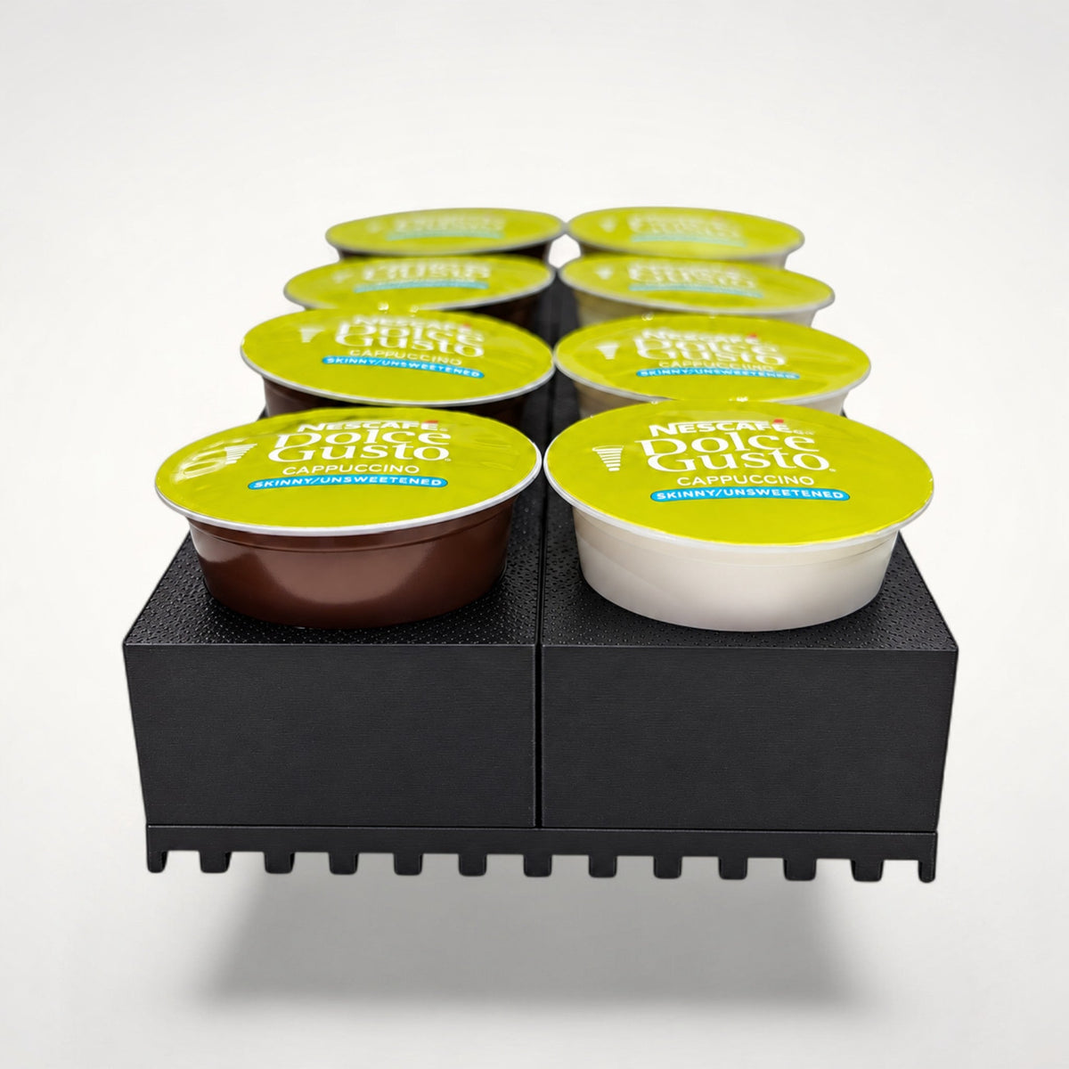 NG Organisers small black coffee pod storage kit holding eight Dolce Gusto capsules in a neat two-row arrangement.