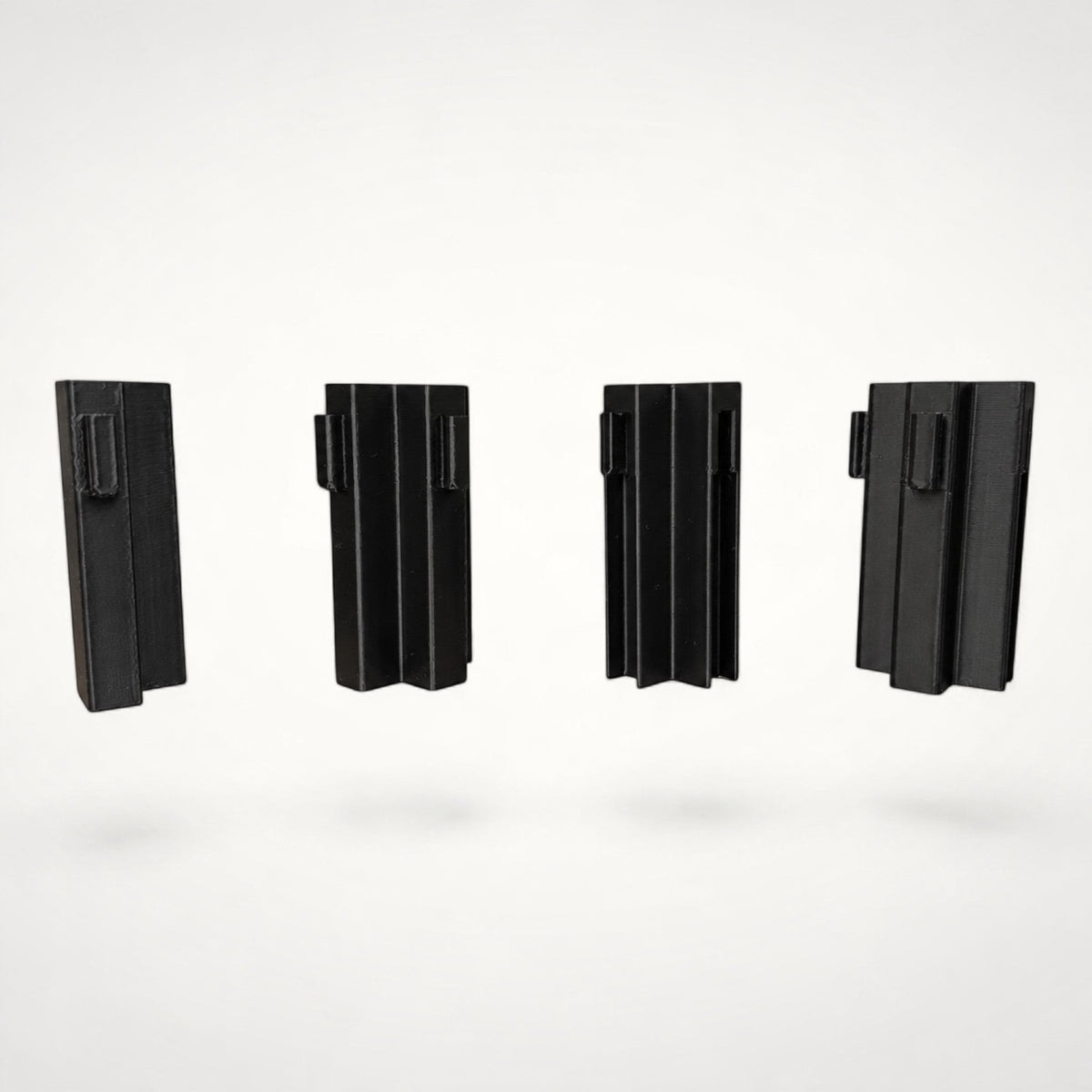 NG Organisers Tee Double Male Wall Module in black for creating T-shaped junctions in drawer divider systems.